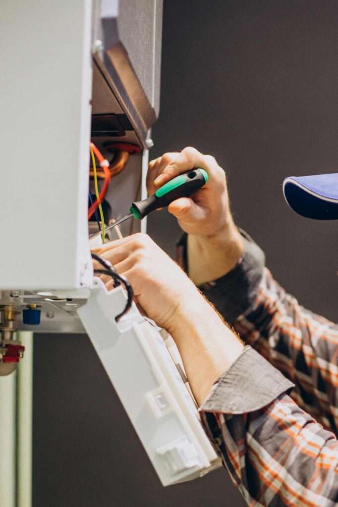 service man adjusting house heatem