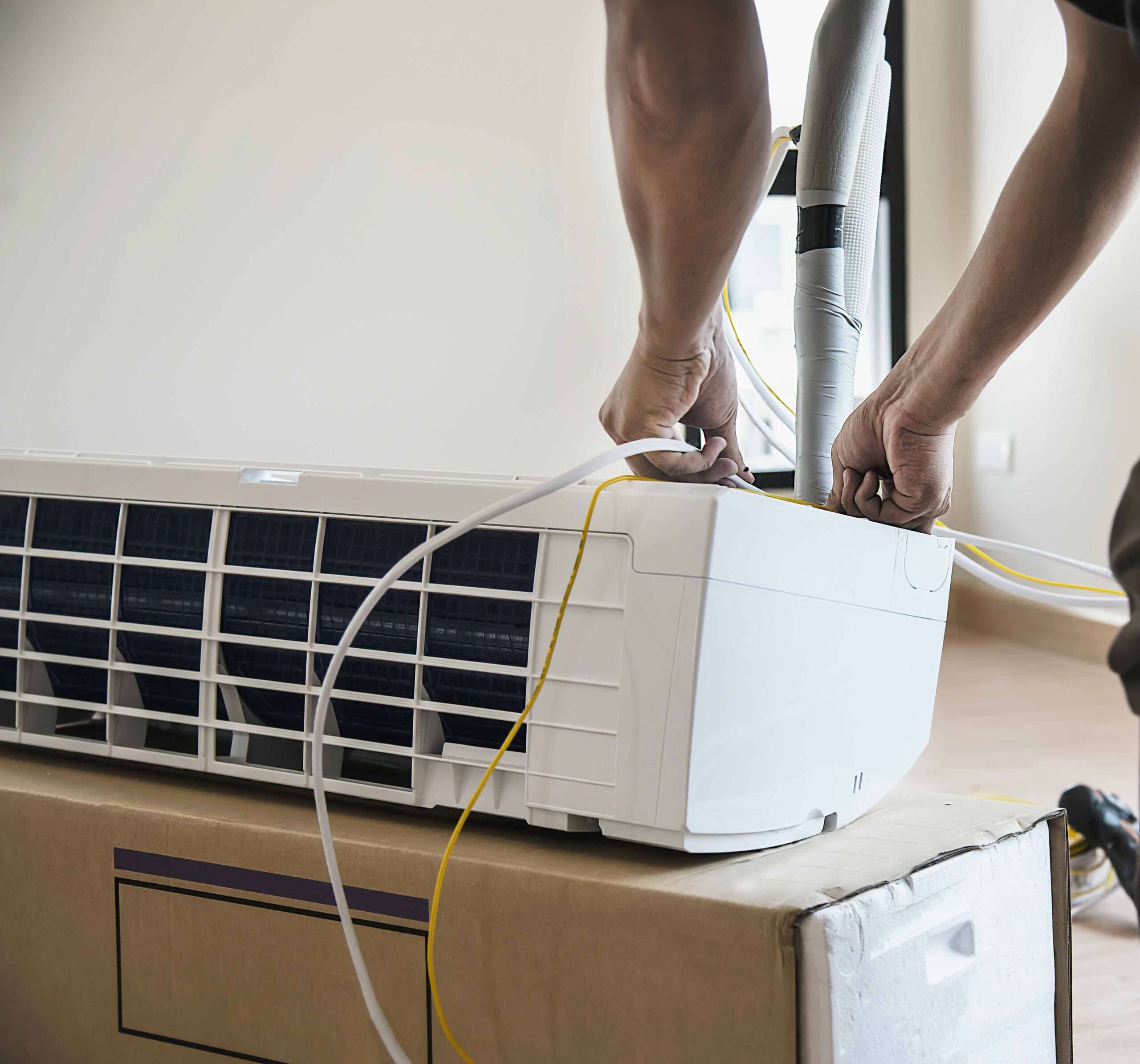 installing air conditioner in housing unit during hot